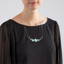 Load image into Gallery viewer, Varying Sized Curved Moon Phase Necklace in Silver
