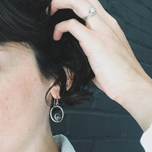 Load image into Gallery viewer, Circle Silver Earrings with Raw Meteorite
