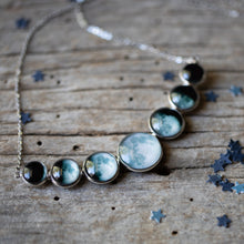 Load image into Gallery viewer, Varying Sized Curved Moon Phase Necklace in Silver
